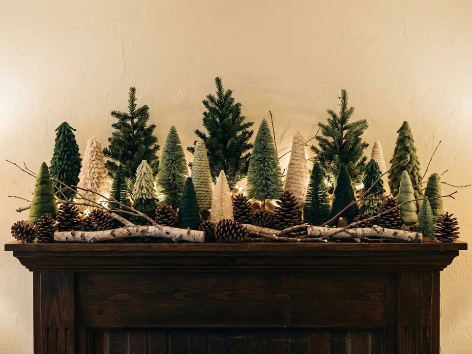Forest style Christmas mantel with small trees, pinecones, and branches